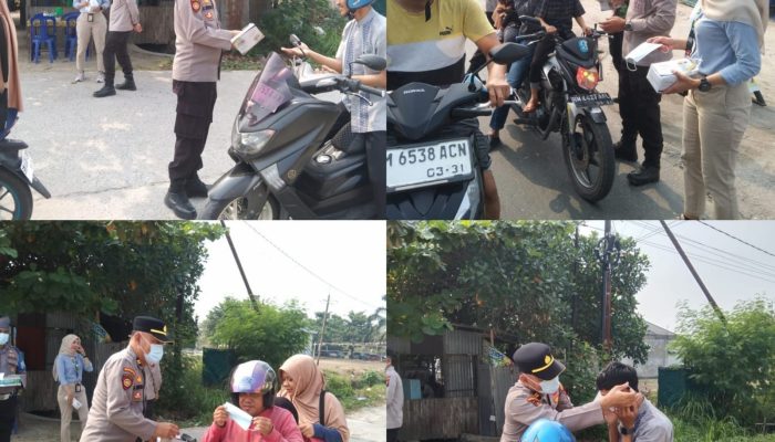 Kapolsek Siak Hulu Bagikan 1000 Masker Gratis, Antisipasi Dampak Kabut Asap